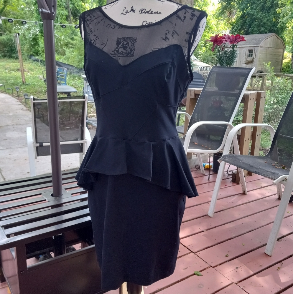 Sexy little black peplum dress by Bebe